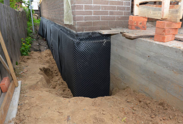 Happy homeowners after waterproofing job in Carbon